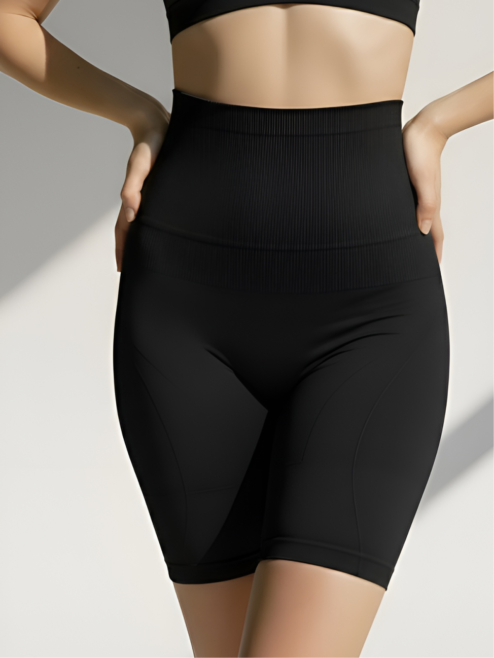 Black high-waist tummy control shorts with ribbed waistband and firm shaping support