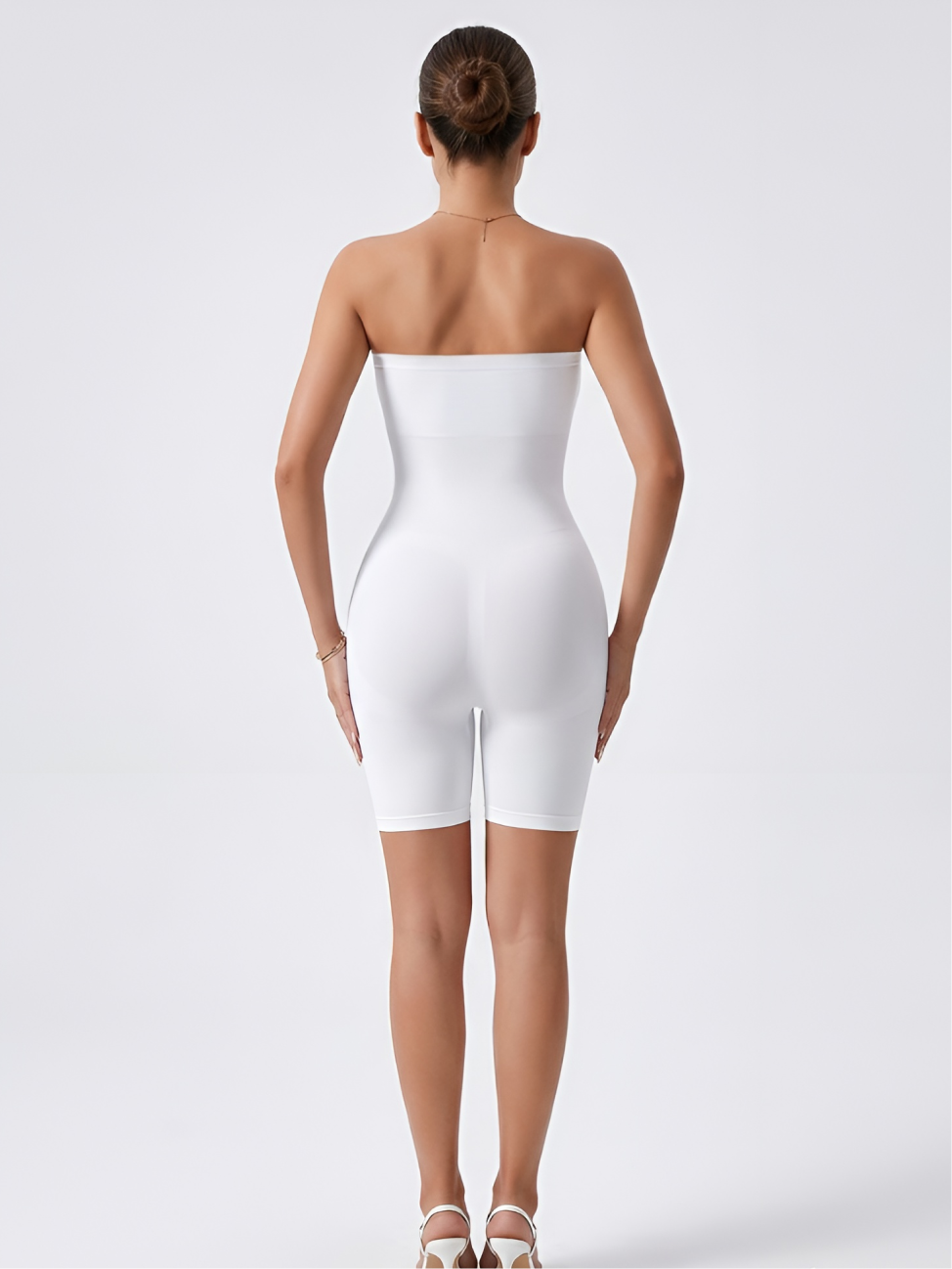 Back view of white strapless shorts shaper with seamless support and thigh coverage