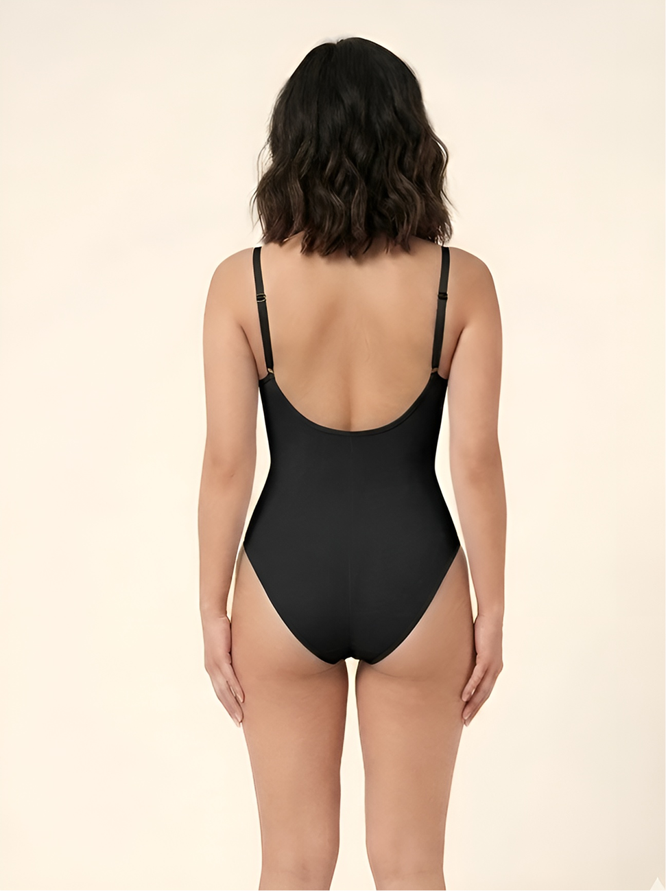Back view of black backless waist shaper bodysuit with low open back and smooth support